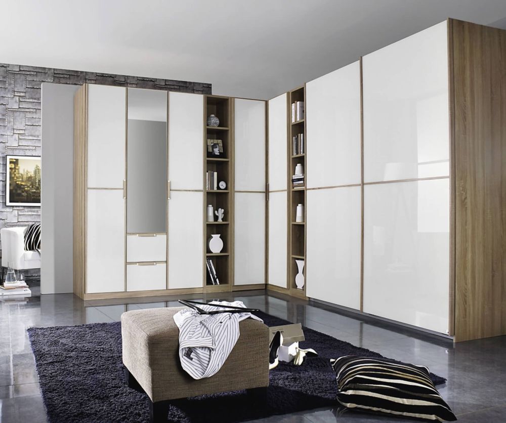 Rauch Essensa Sonoma Oak with White Glass L Shaped Folding Wardrobe with Vertical and Horizontal Trims and Chrome Coloured Handle (W528cm)