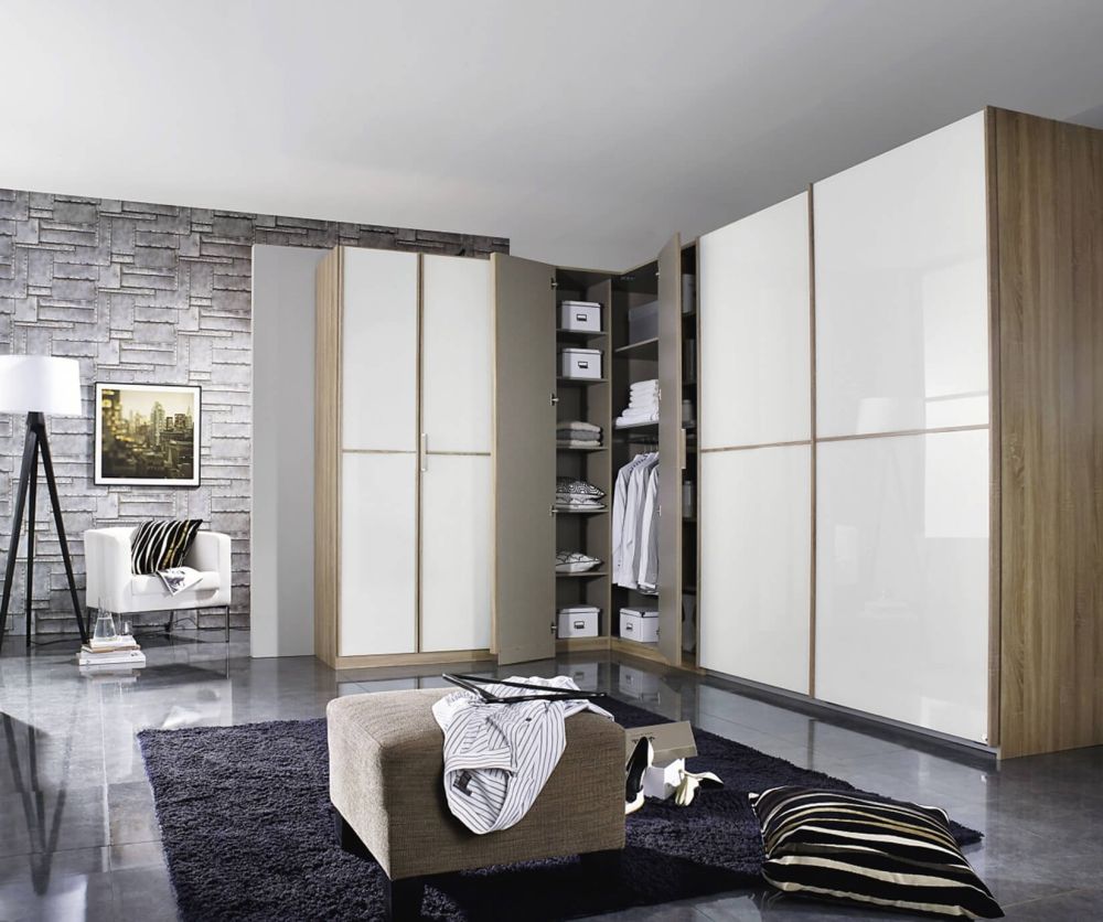 Rauch Essensa Sonoma Oak with White Glass L Shaped Folding Wardrobe with Vertical and Horizontal Trims and Carcass Coloured Handle (W438cm)