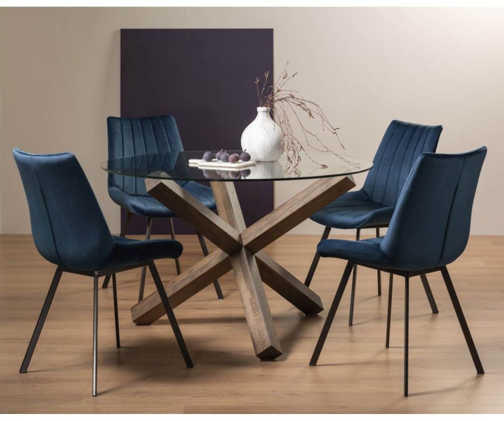 Bentley Designs Turin Dark Oak Circular Glass Dining Table and 4 Fontana Blue Velvet Fabric Chairs with Black Legs